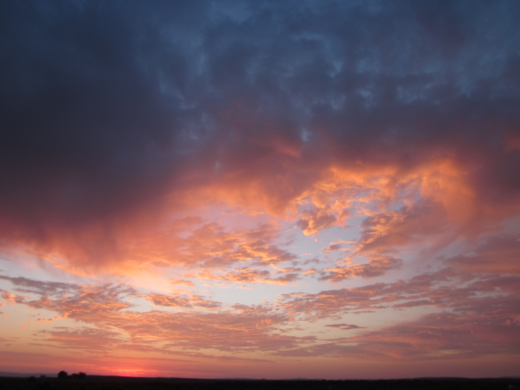 Prairie Sunset with brilliant oranges and purples 
