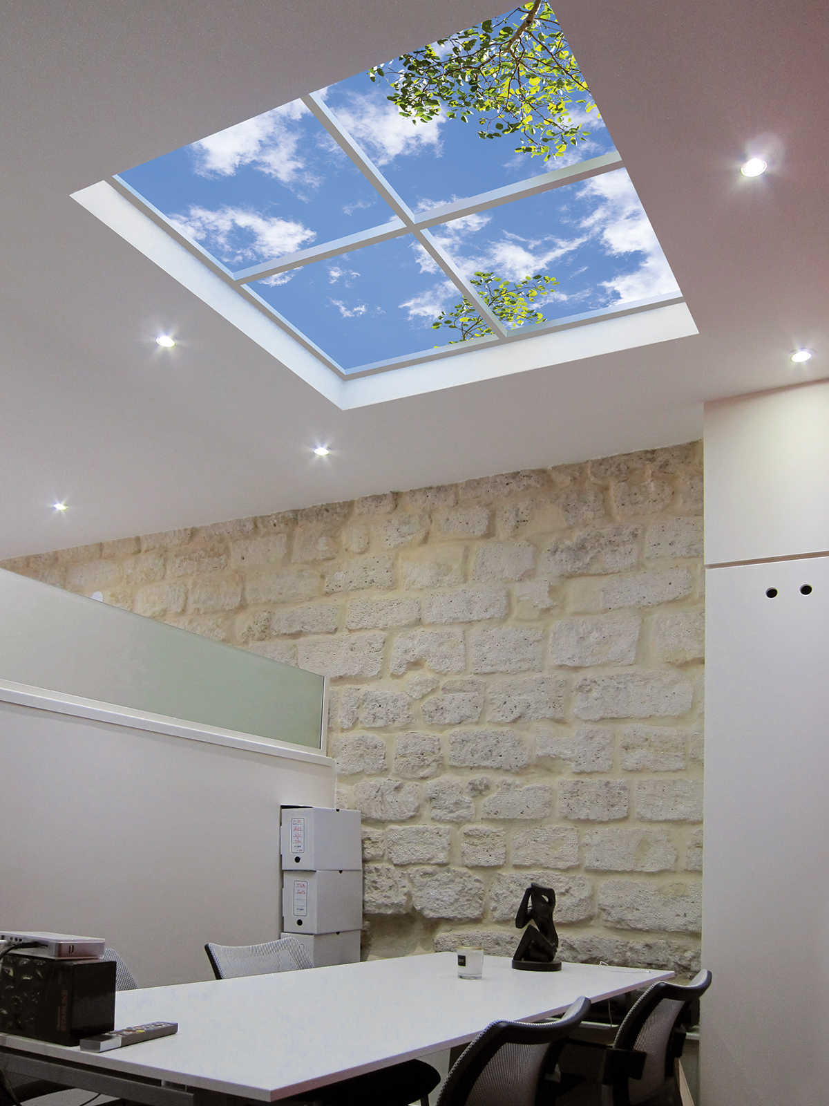 Recessed artificial skylight creates a perceived zenith that provides sensory-rich relaxation.